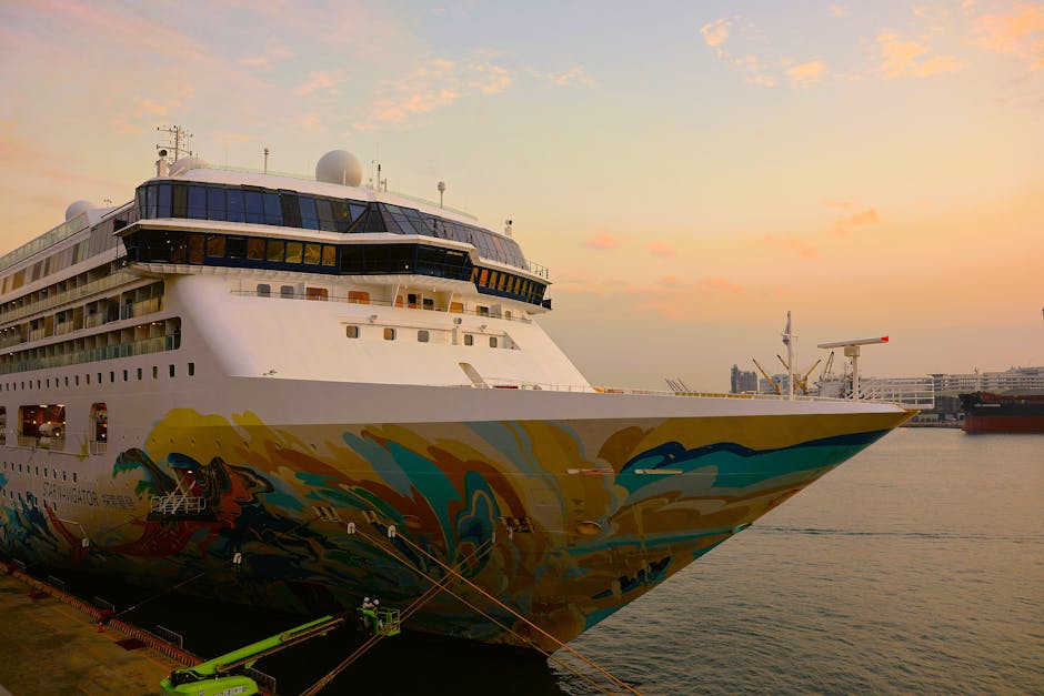 A vibrant cruise ship at sunset in a Taiwan harbor, showcasing colorful murals and a serene atmosphere.