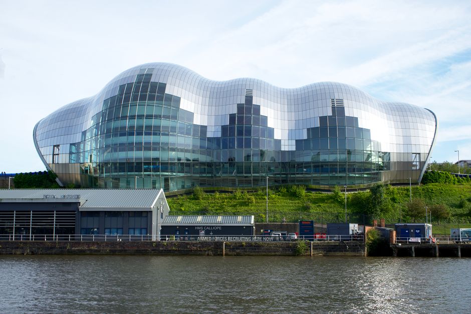 Photo of the modern Sage Gateshead music venue by the River Tyne in Newcastle, England.